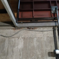 Автоматический люк в подвал дома.