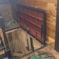 Автоматический люк в подвал дома.