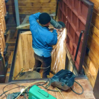 Автоматический люк в подвал дома.